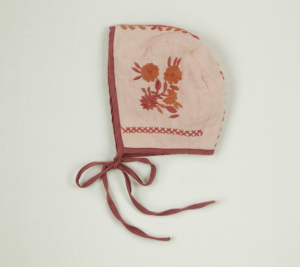Pink embroidered baby bonnet