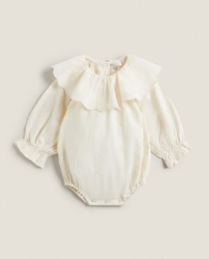 white embroidered ruffle bodysuit